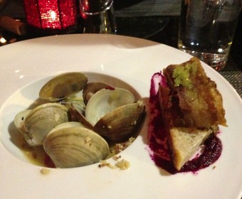 Steamed clams in wasabi and smoked bacon sauce. Served with pork belly and ciabatta over beet puree.